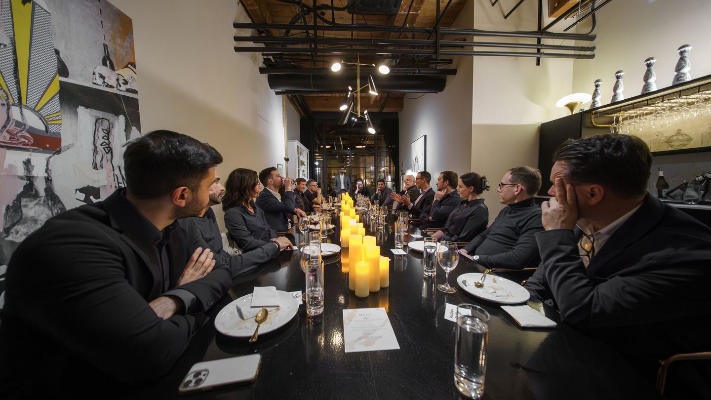 A private Table Ronde dinner at one long candlelit table